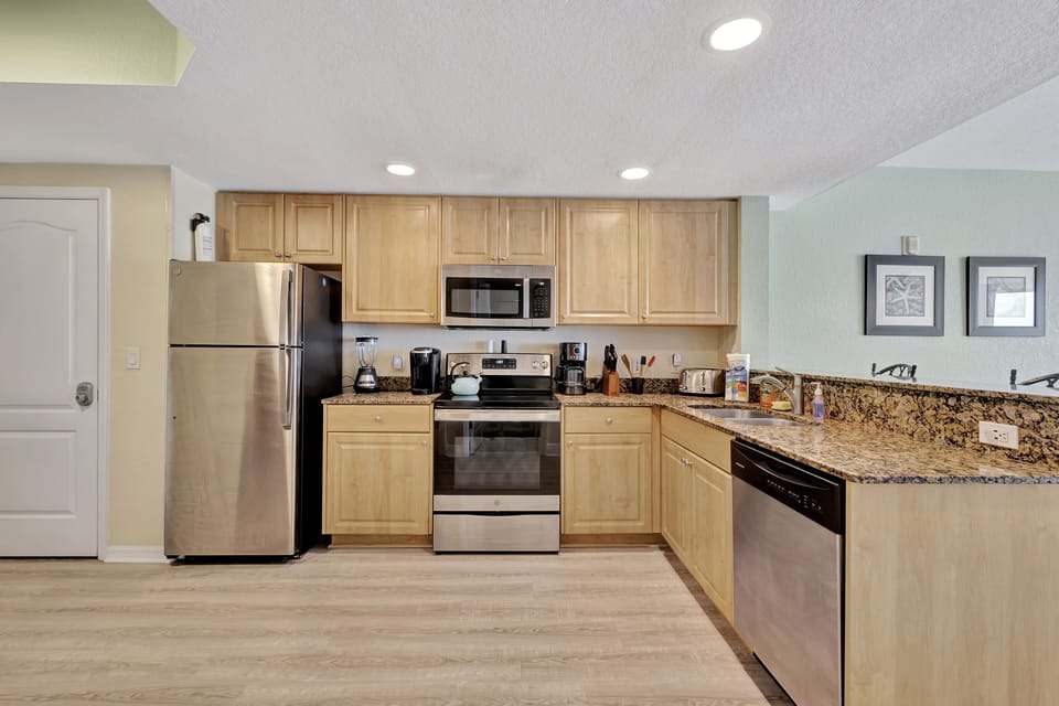 Full kitchen: refrigerator, dishwasher, stove/oven, microwave, coffee makers. 