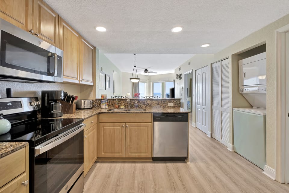Full kitchen: refrigerator, dishwasher, stove/oven, microwave, coffee makers. 