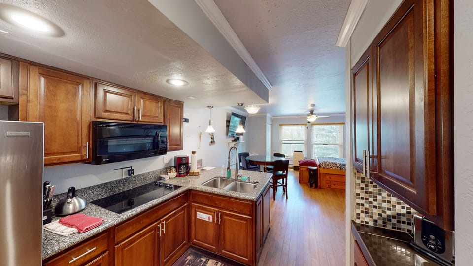 Full Kitchen with Full Size Refrigerator, Glass Stove Top, Oven & Microwave