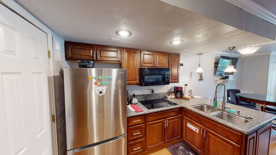 Full Kitchen with Full Size Refrigerator, Glass Stove Top, Oven & Microwave