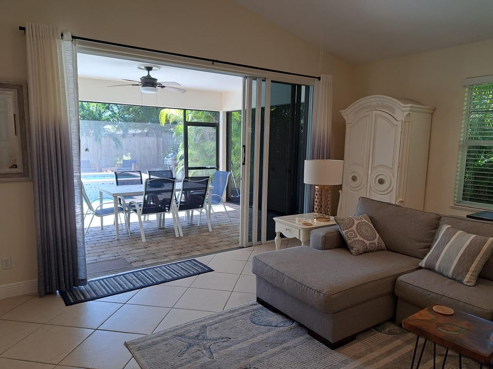Large sliders which open to the lanai & pool deck