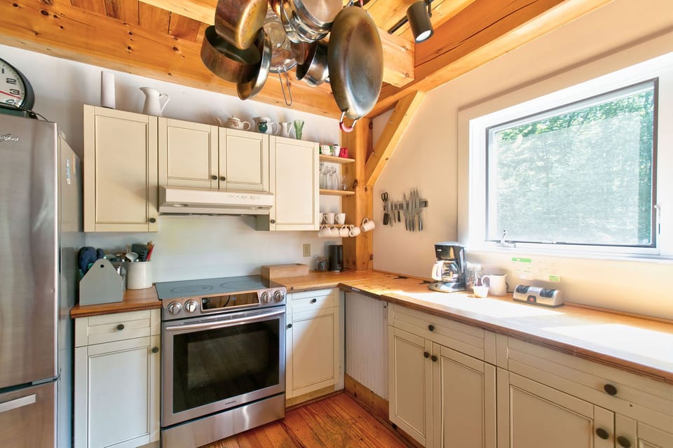 Full kitchen with Japanese chefs knives, copper pots, blender, coffee maker