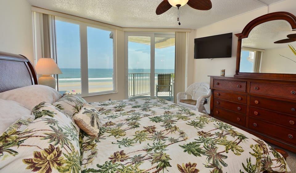 Master suite with all glass views of the ocean and direct access to the patio.
