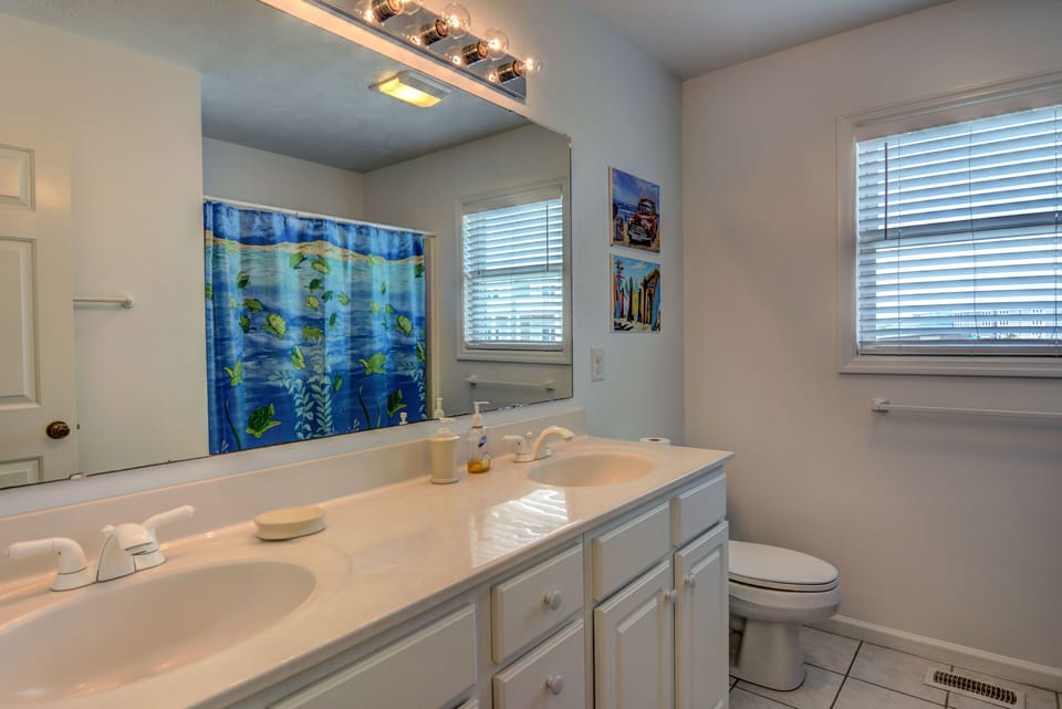 Large downstais 3rd bathroom with double vanity, tub and shower