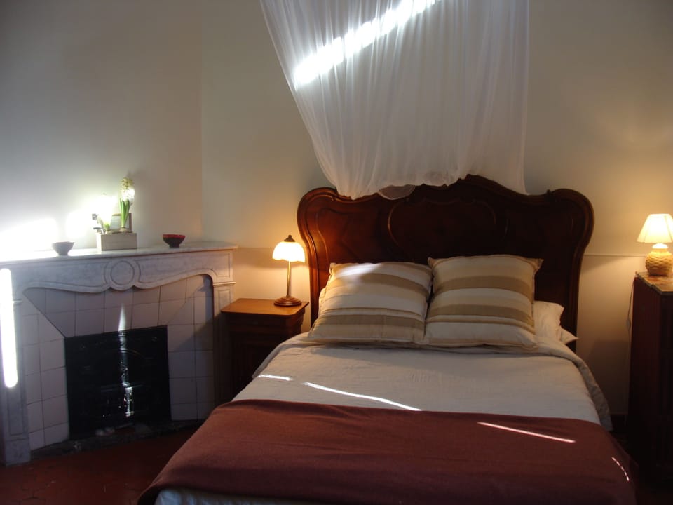 The master bedroom furnished with French antiques.