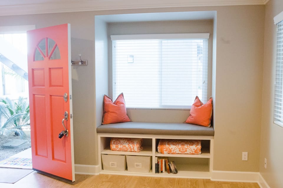 Adorable window seat for a bright and airy reading nook