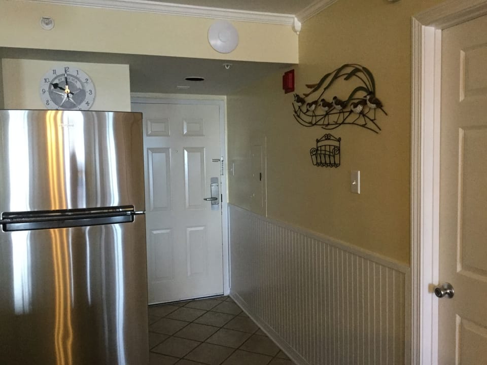 Freshly painted entry wall & bead board.  Beachy new kitchen wall clock & decor