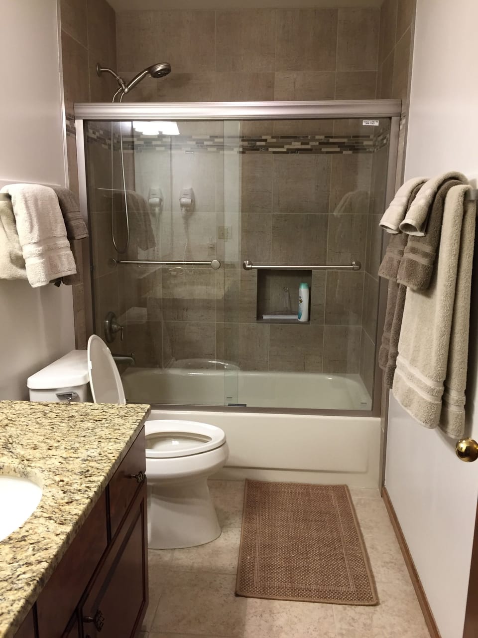 Newly remodeled Queen bathroom with tub shared with upstairs bunk room