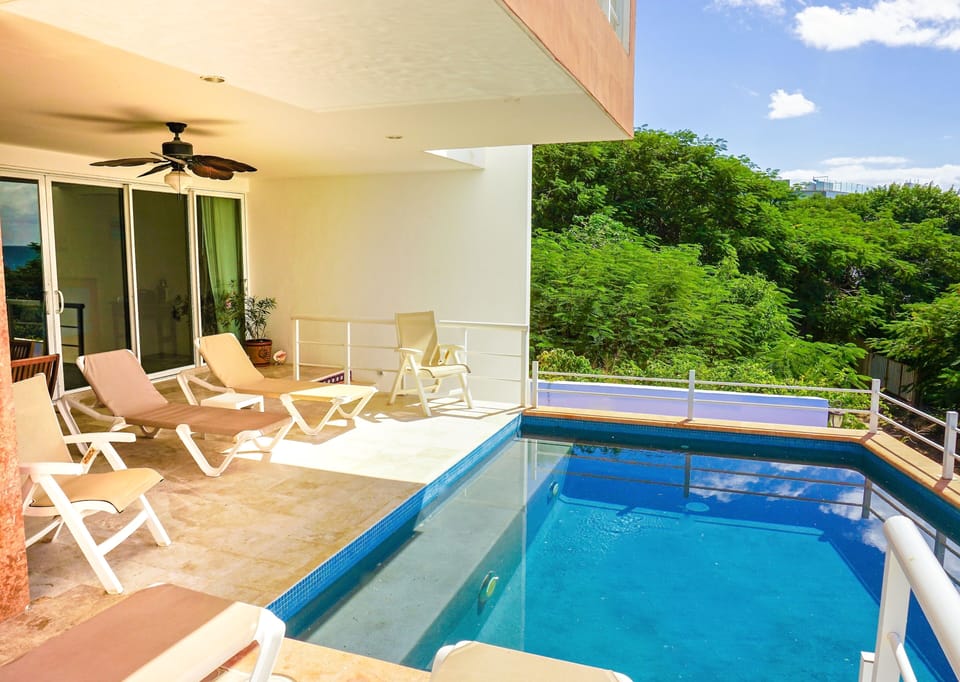 The entry stairway leads you to a beautiful outdoor patio & pool area