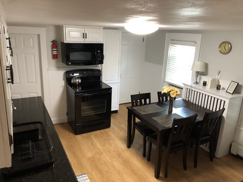 Kitchen exit to right side driveway.
