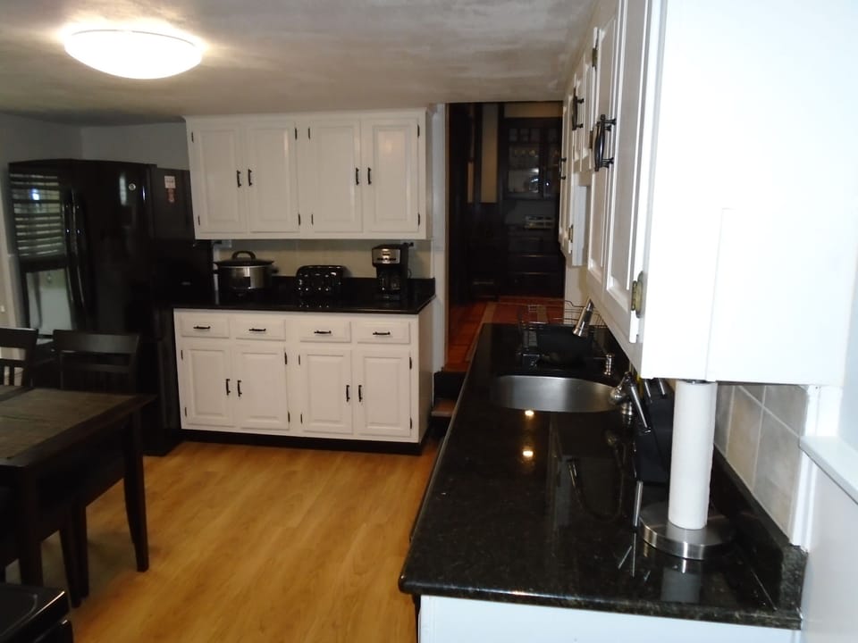 Kitchen sits 4 with dishware for 8.