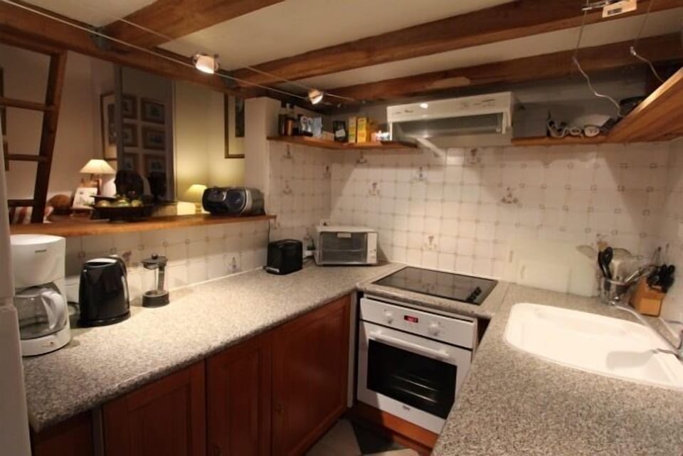 Kitchen showing oven, cooktop and toaster oven, etc