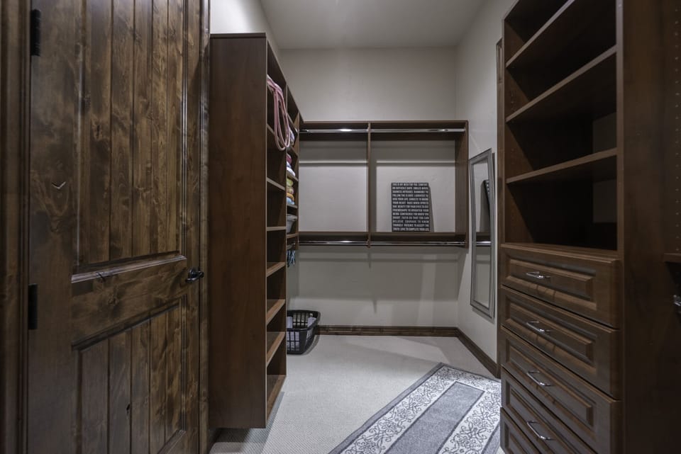 master closet with play pen, drawers and plenty hangers for hanging clothes...