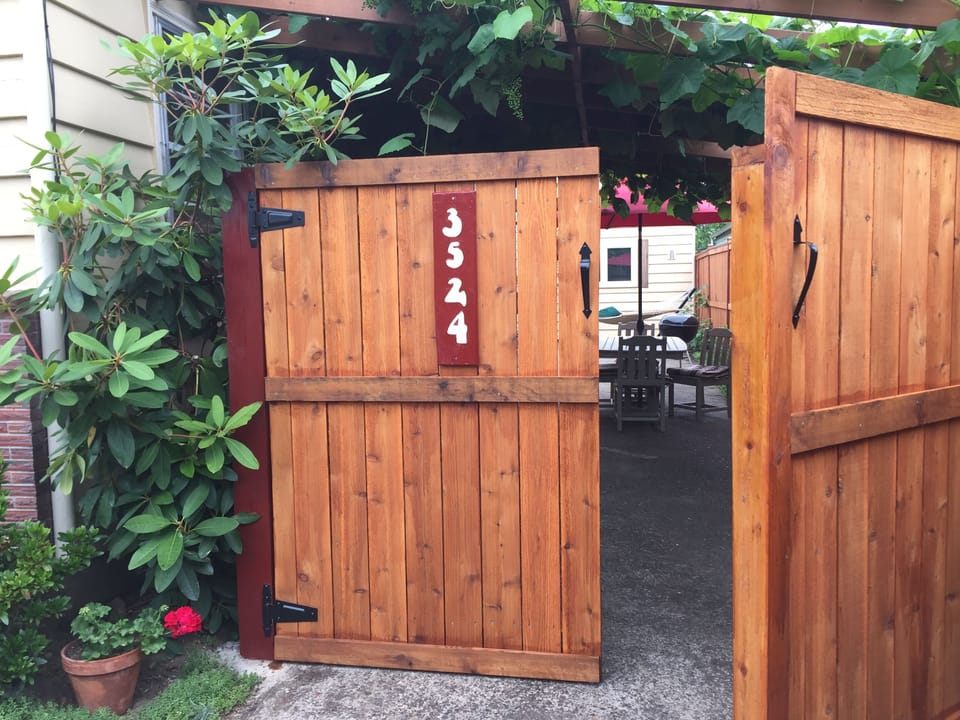 Through the gate is the entrance to Auntie's Hideaway--and patio and garden.
