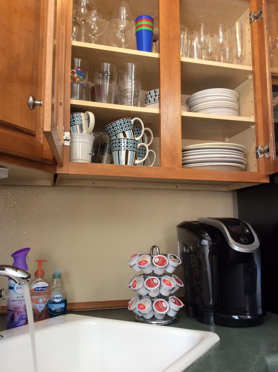 Plenty of glassware, Keurig coffee maker and k-cups provided