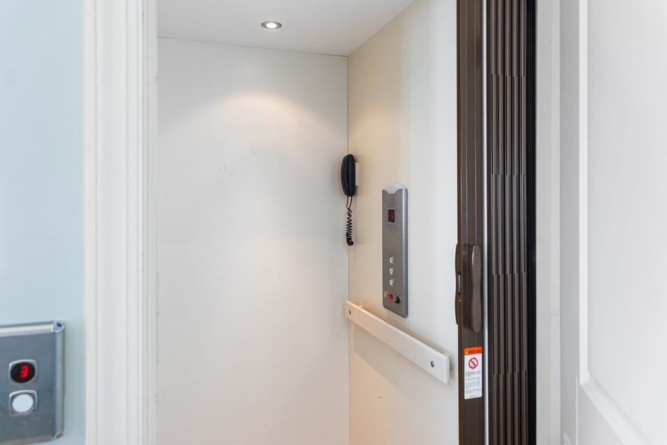 Elevator goes from ground level to top floor.