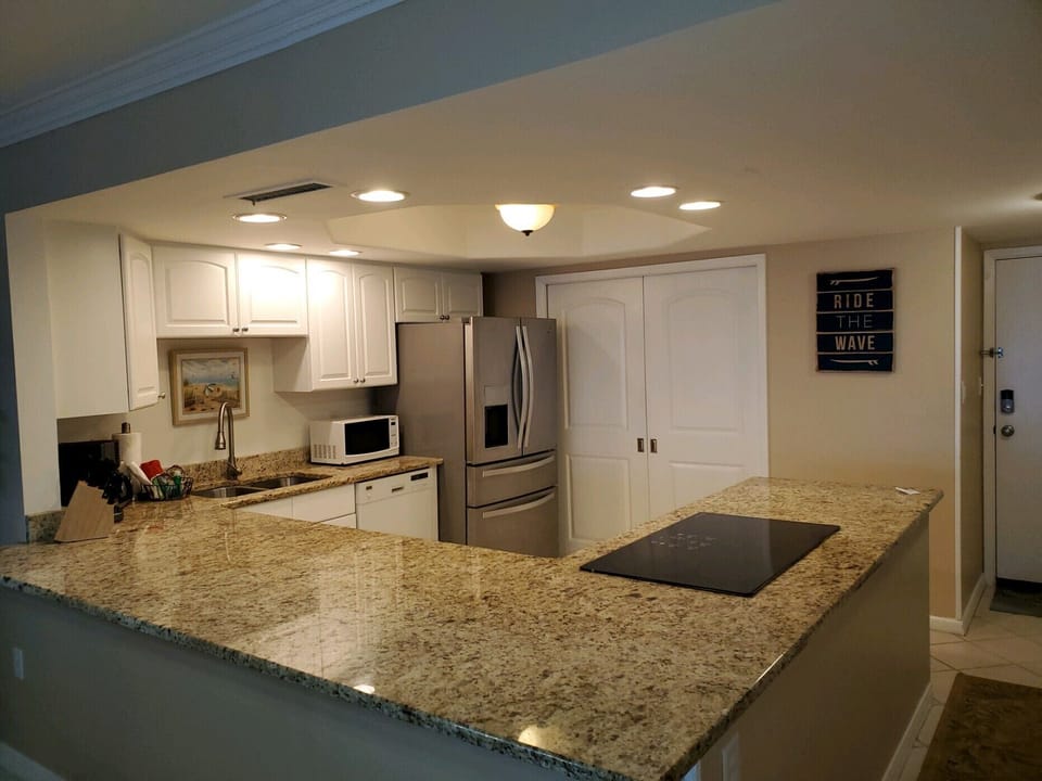Granite Countertop Kitchen with 36 inch glass cooktop, French Door Refrigerator 