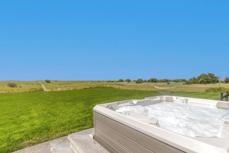 Soak in the Hot Spring hot tub with the sound of the ocean in the background