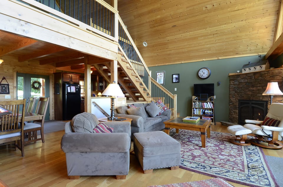 Living room, dining room, and kitchen in open main level floor plan.