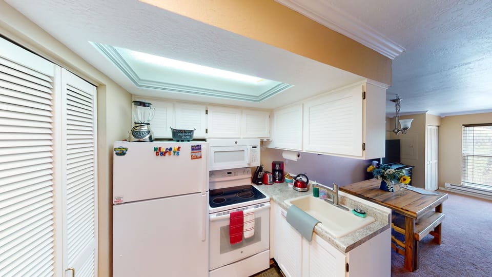 Full Kitchen with Full Size Refrigerator, Glass Stove Top, Oven & Microwave