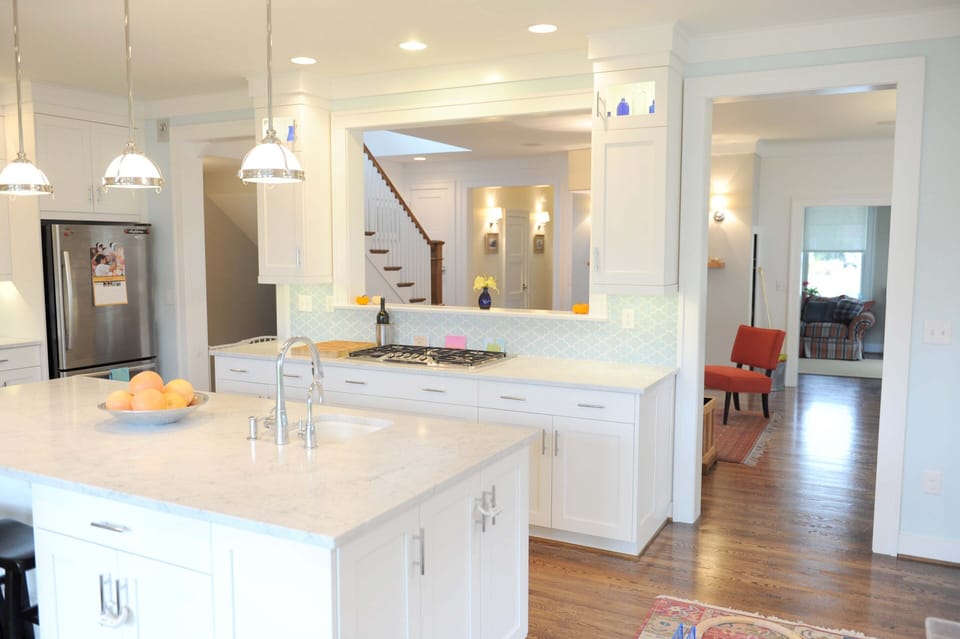 The kitchen has Carrera marble countertops and stainless steel appliances