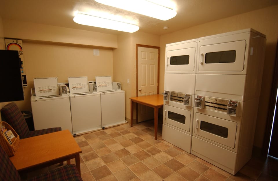 Coin operated guest laundry facility and vending (food & drinks).