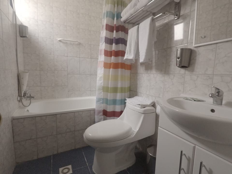 Family Room, Multiple Beds | Bathroom | Shower, free toiletries, hair dryer, towels