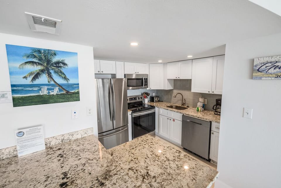 Condo, 2 Bedrooms, Balcony, Beachfront (308) | Private kitchen | Full-size fridge, microwave, oven, stovetop