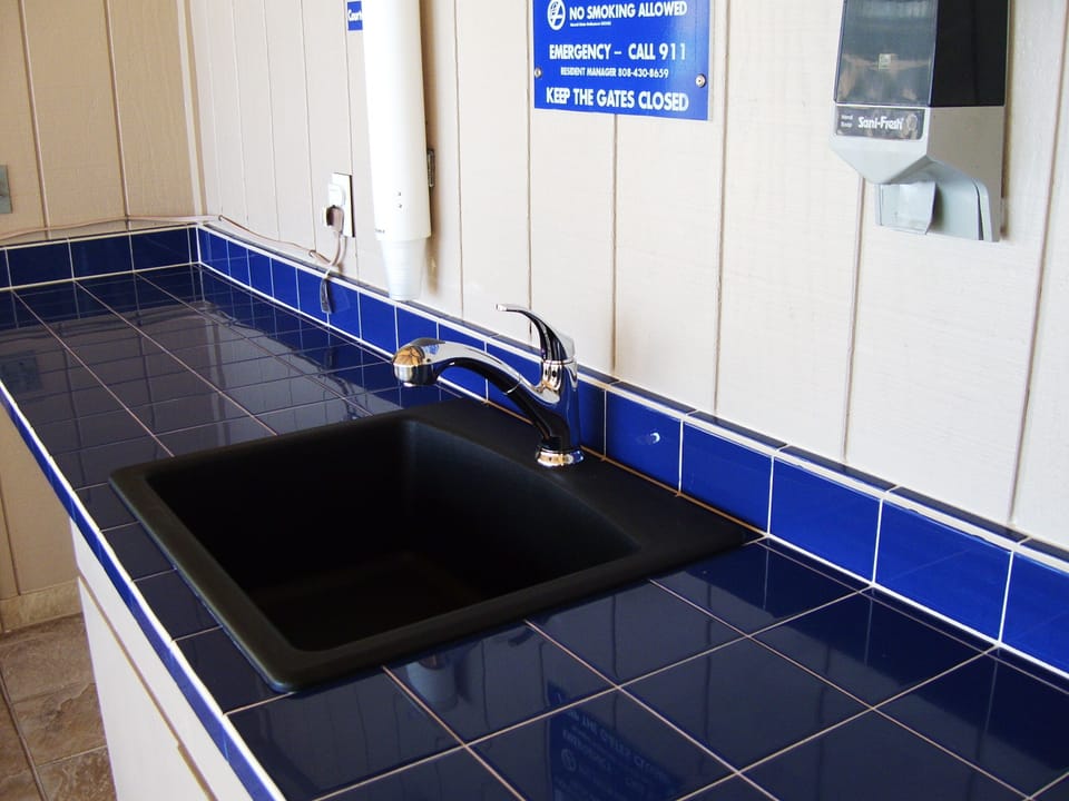 Sink and counter tops at BBQ area.