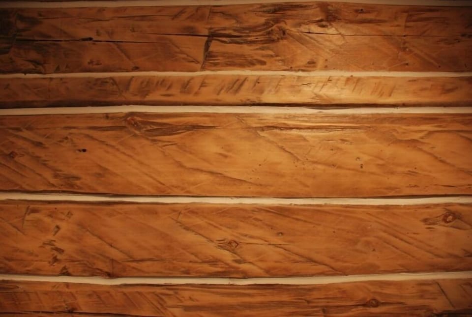 Beautiful original log walls with remodeled chinking. Notice the axe marks from when these were squared off.