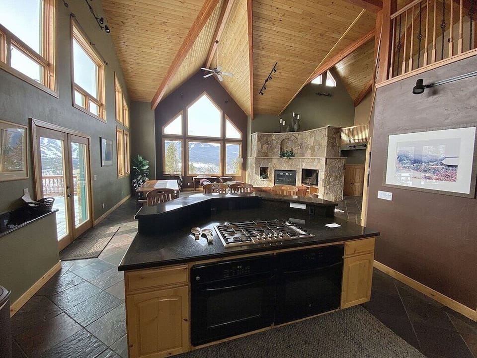 Kitchen - Fully stocked kitchen with two ovens, five gas burners, counter seating