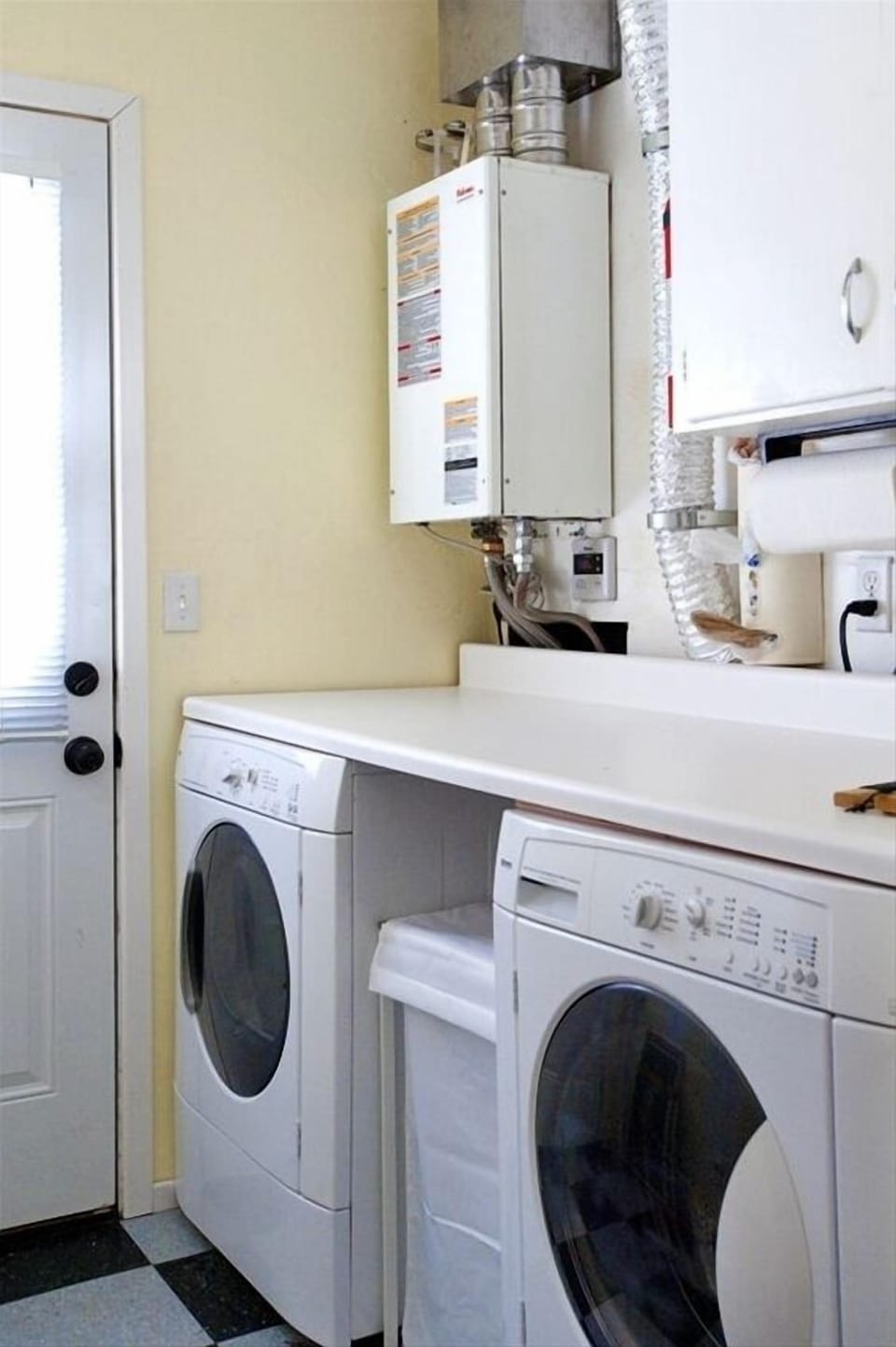Laundry Room with a door to the backyard.