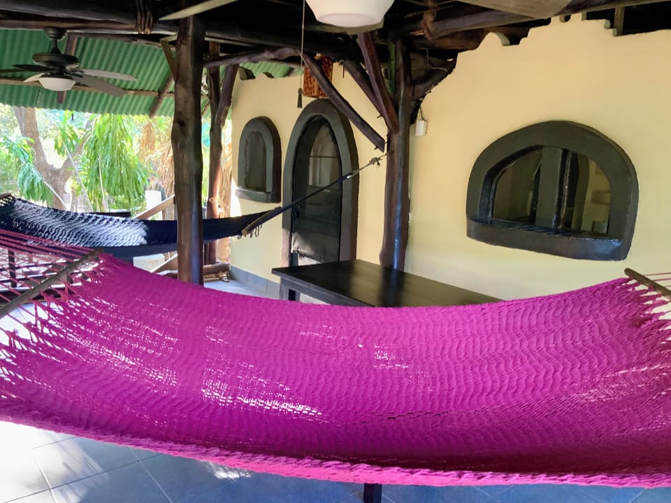 Relax in your shaded hammock with a cool ocean breeze