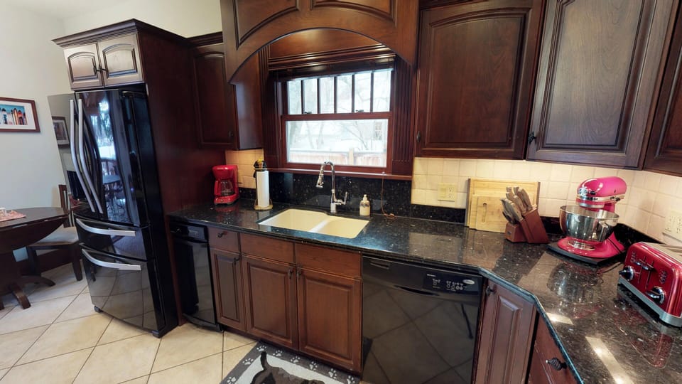 Cherry cabinets, granite counter tops.