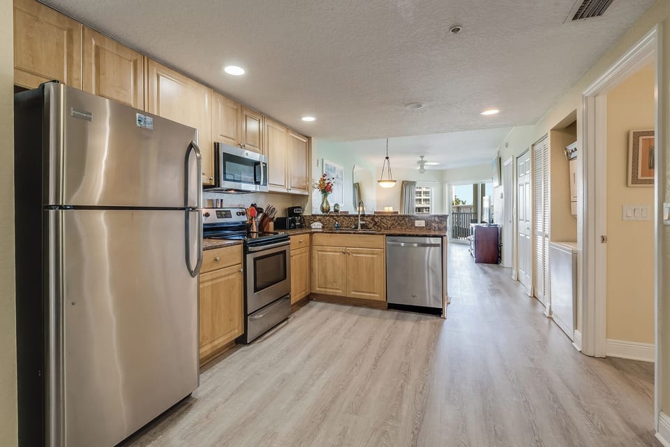 Full kitchen: refrigerator, dishwasher, stove/oven, microwave, coffee makers. 