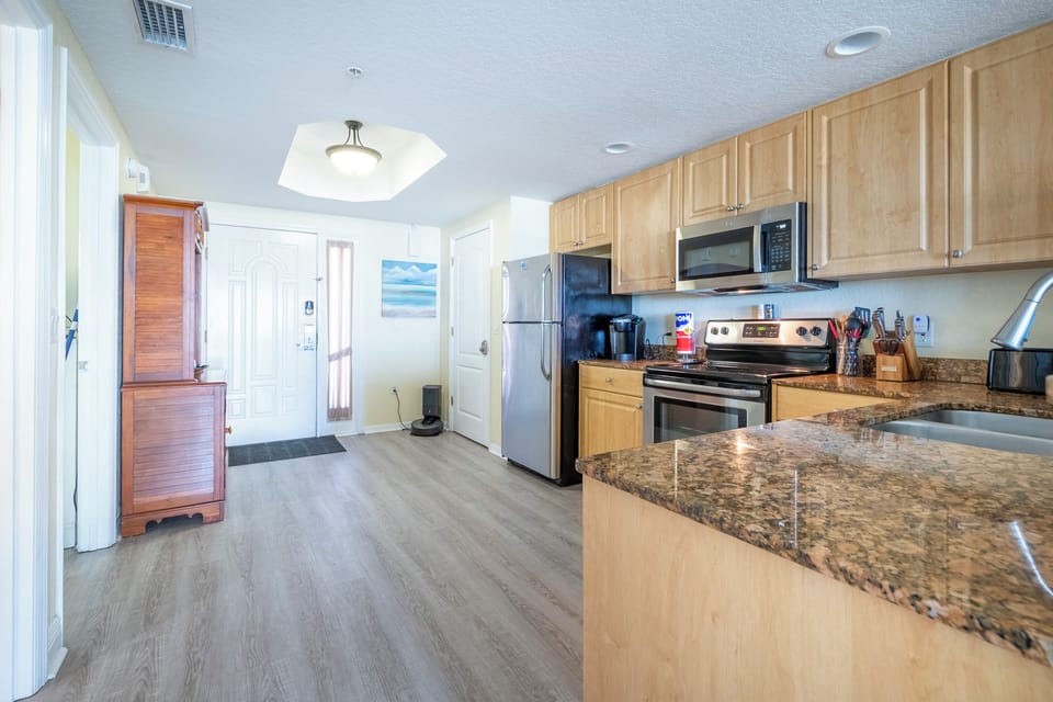 Full kitchen: refrigerator, dishwasher, stove/oven, microwave, coffee makers. 
