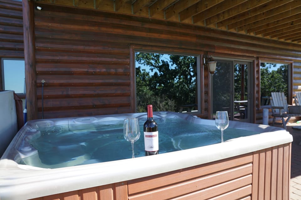 private outdoor hot tub on patio is crystal clear, inviting, romantic