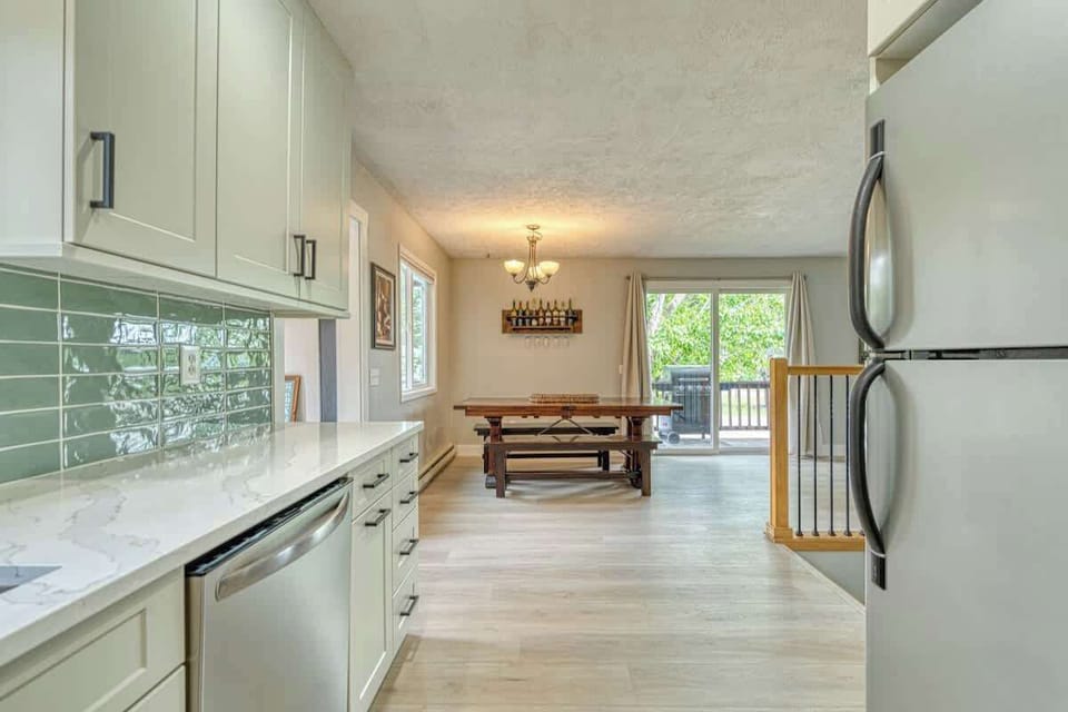 Kitchen and dining area. Dining table seats 8 with leaf spring 