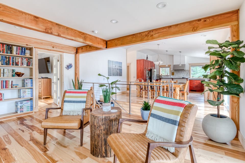 The upstairs living room is open to the dining room and kitchen