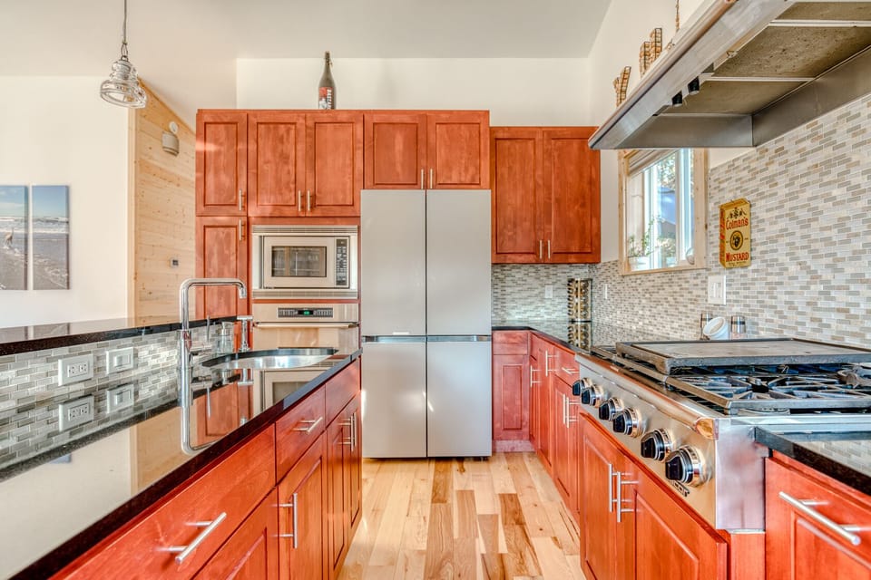 Gas stove top and a large variety of stainless and cast iron pots and pans