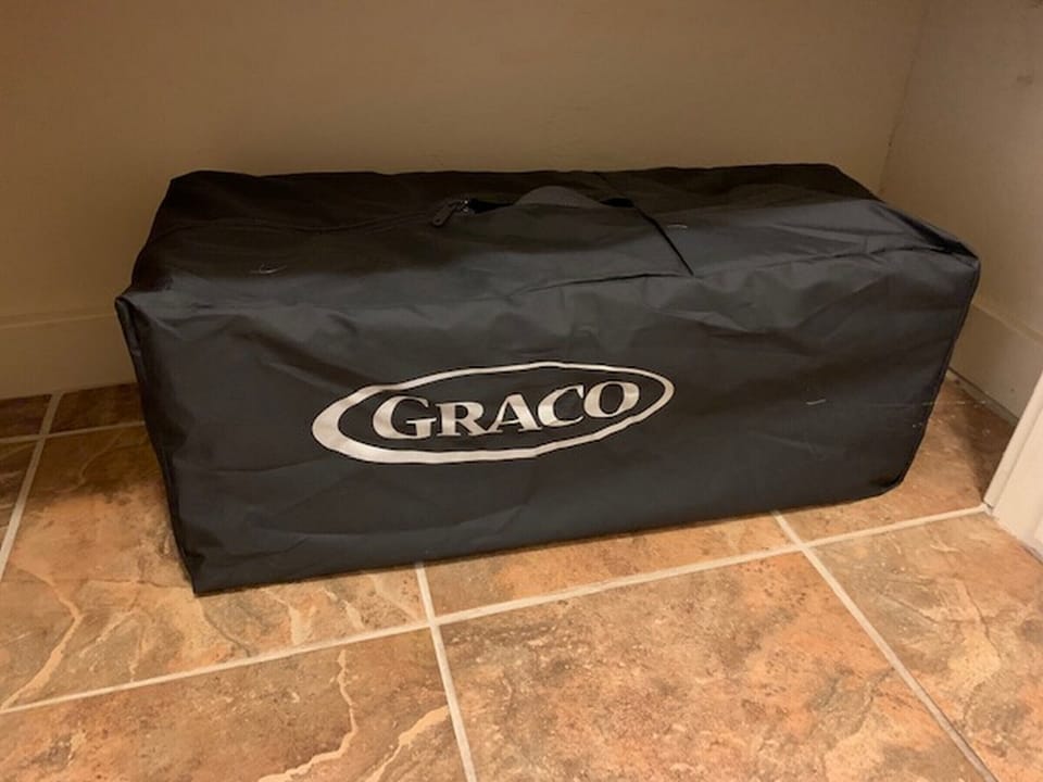 Pack n' Play stored in hallway closet. There is a high chair stored in garage.