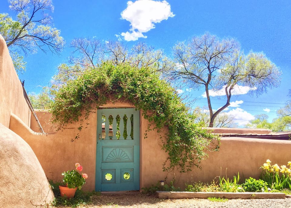 Adobe walls and hand carved gates create private courtyards for our guests. 