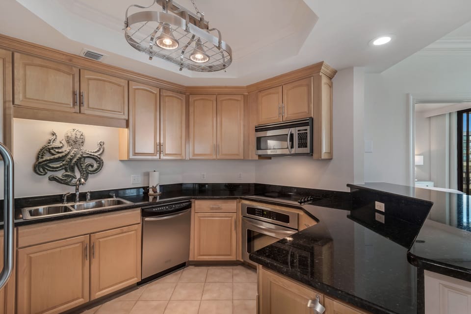 Fully stocked kitchen with stainless appliances 