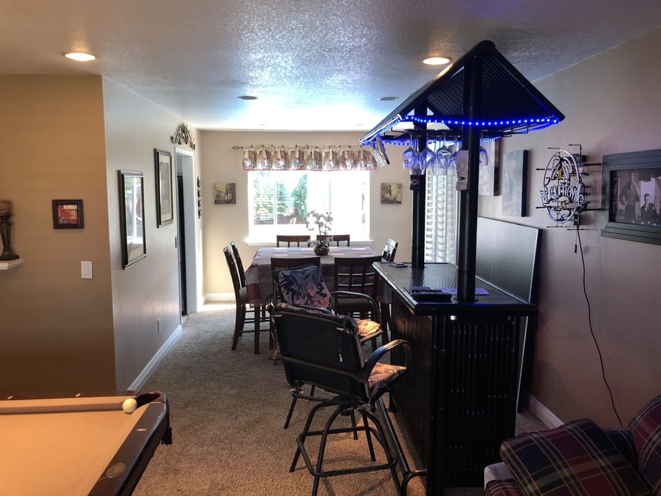 Home flows nicely has a great tiki bar with large dining area that seats  eight