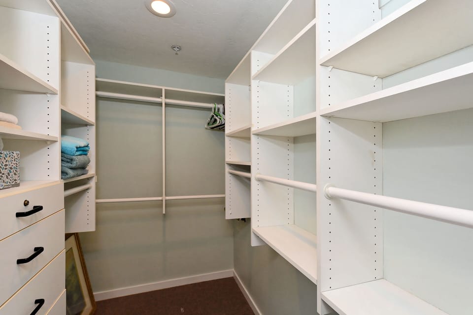 hers' closet is through master bathroom, his' closet is left side of king bed