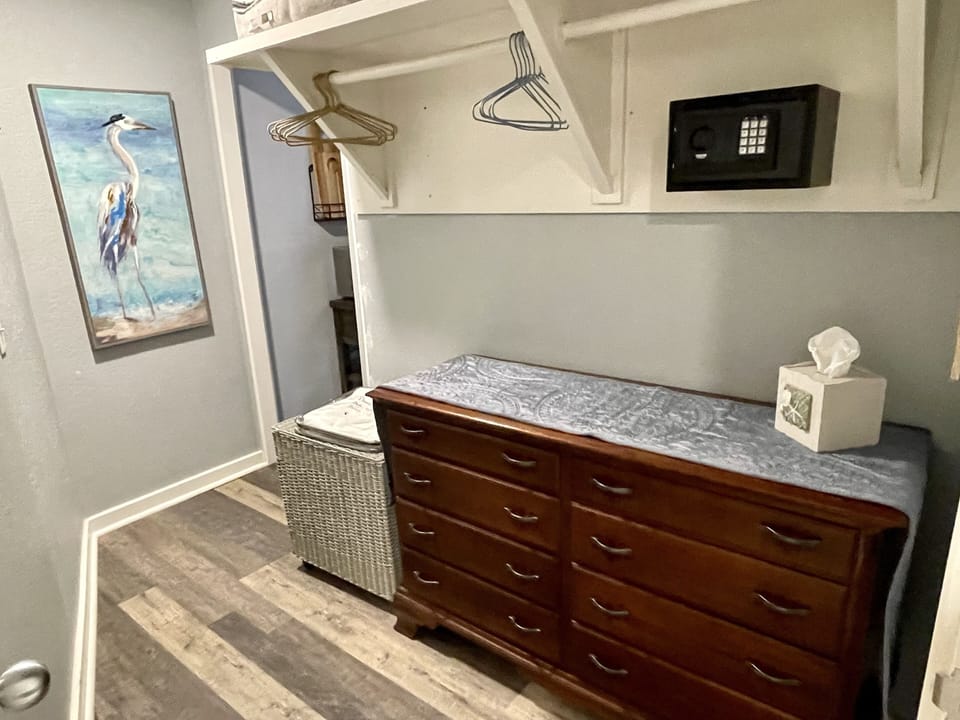 Dressing area with safe. Adjoins bathroom.