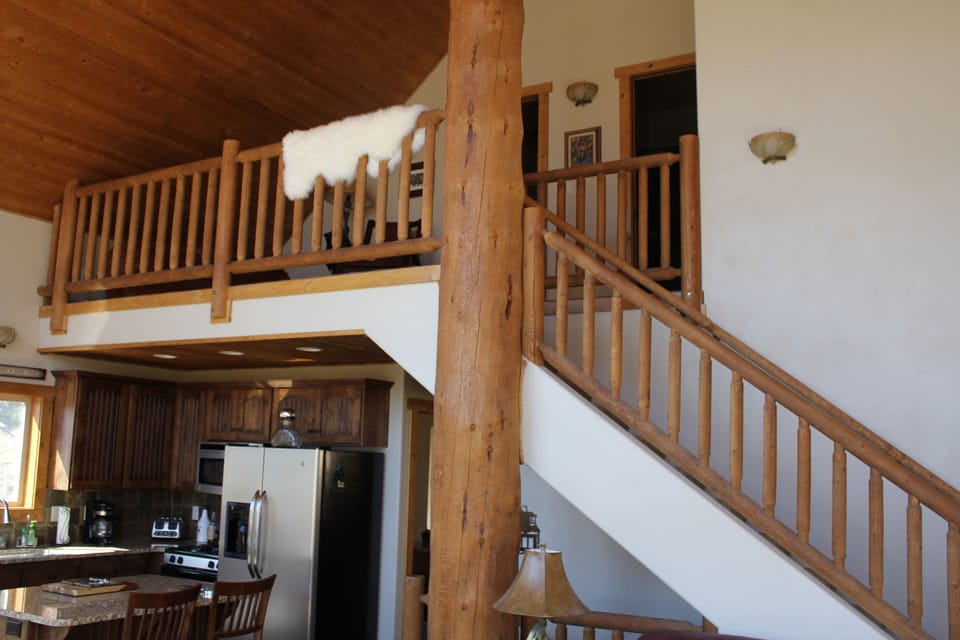 Third floor loft area has comfy bean bag chair, two bedrooms, and a full bath