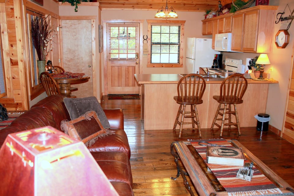The kitchen flows into the living-room with a cozy warm feeling.