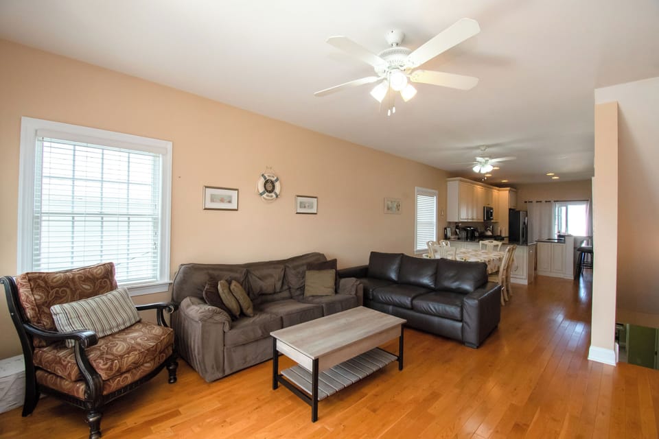 2nd floor Living room area with seating and open concept view of dining/kitchen