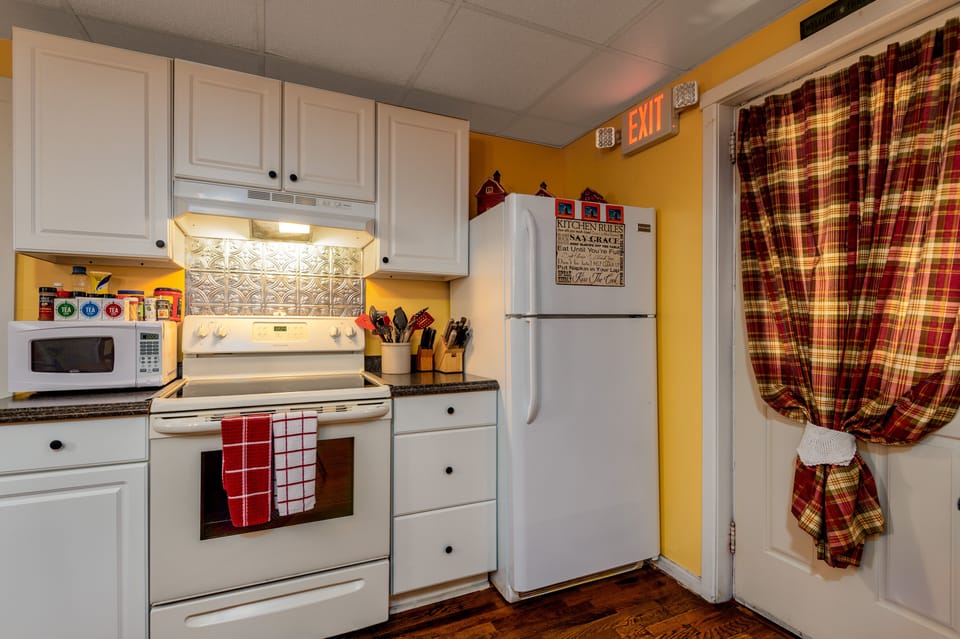 Enter the back door to the rustic Kitchen